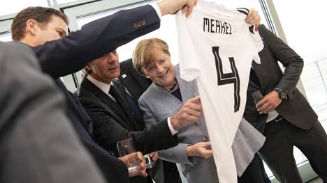 German Chancellor Merkel Receives Football Delegation
