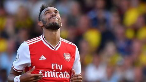 Arsenal's Gabonese striker Pierre-Emerick Aubameyang reacts to a missed chance during the English Premier League football match between Watford and Arsenal at Vicarage Road Stadium in Watford, north of London on September 15, 2019. (Photo by Ben STANSALL / AFP) / RESTRICTED TO EDITORIAL USE. No use with unauthorized audio, video, data, fixture lists, club/league logos or 'live' services. Online in-match use limited to 120 images. An additional 40 images may be used in extra time. No video emulation. Social media in-match use limited to 120 images. An additional 40 images may be used in extra time. No use in betting publications, games or single club/league/player publications. /         (Photo credit should read BEN STANSALL/AFP/Getty Images)