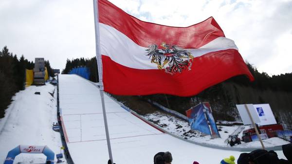 An Austrian flag is waving in the wind at the skiflying worldcup on January 14, 2018, at the Kulm in Bad Mitterndorf, Austria. The competition was canceled due to wind.  / AFP PHOTO / APA / ERWIN SCHERIAU / Austria OUT        (Photo credit should read ERWIN SCHERIAU/AFP via Getty Images)