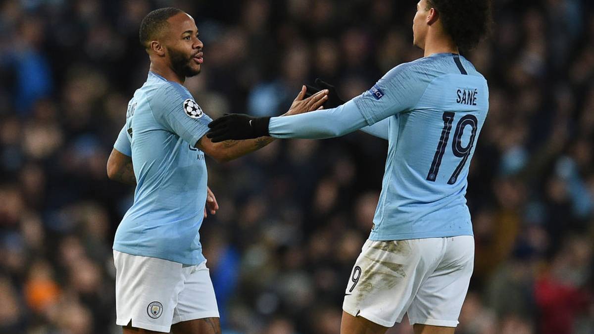Manchester City's English striker Raheem Sterling (L) celebrates with Manchester City's German midfielder Leroy Sane after scoring their fourth goal during the UEFA Champions League round of 16 second leg football match between Manchester City and Schalke 04 at the Etihad Stadium in Manchester, north west England, on March 12, 2019. (Photo by Oli SCARFF / AFP)        (Photo credit should read OLI SCARFF/AFP via Getty Images)