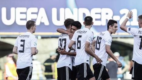 Germany's forward Luca Waldschmidt (C-L) celebrates with Germany's midfielder Nadiem Amiri (C) after Waldschmidt scored a penalty during the semi-final match of the U21 European Football Championships between Germany and Romania on June 27, 2019 at the Renato Dall'Ara stadium in Bologna. (Photo by Isabella BONOTTO / Update Images Press / AFP)        (Photo credit should read ISABELLA BONOTTO/AFP/Getty Images)