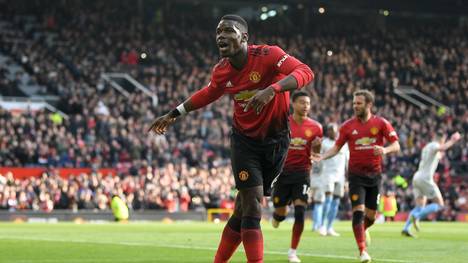 MANCHESTER, ENGLAND - APRIL 13: Paul Pogba of Manchester United celebrates as he scores his team's first goal from the penalty spot during the Premier League match between Manchester United and West Ham United at Old Trafford on April 13, 2019 in Manchester, United Kingdom. (Photo by Gareth Copley/Getty Images)