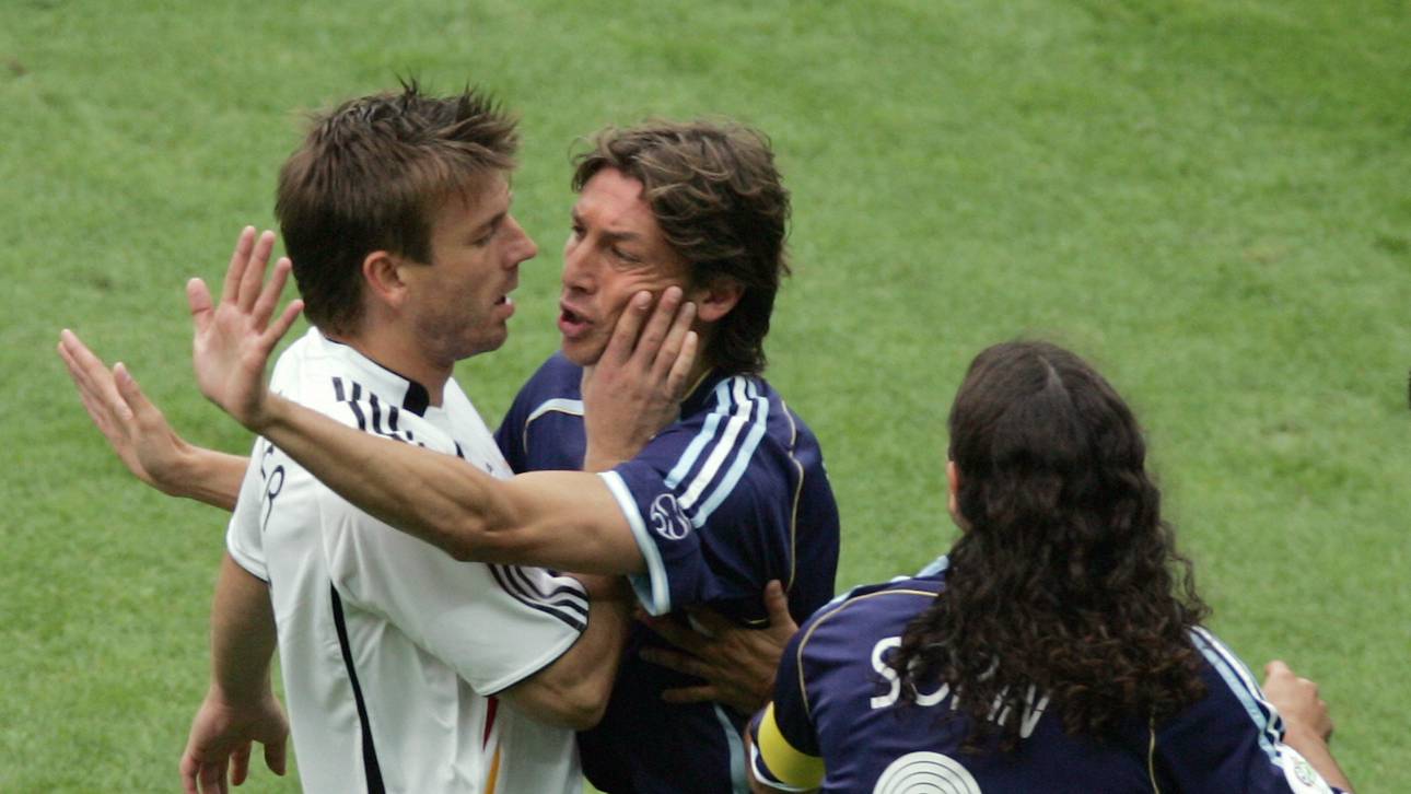 German midfielder Bernd Schneider (L) is
