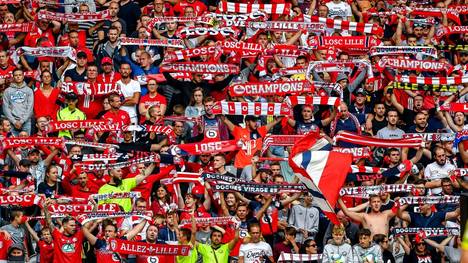 Lille's supporters cheer their team during the French L1 football match between Lille (LOSC) and FC Nantes at the Pierre-Mauroy stadium in Villeneuve-d'Ascq northern France, on August 11, 2019. (Photo by PHILIPPE HUGUEN / AFP)        (Photo credit should read PHILIPPE HUGUEN/AFP/Getty Images)