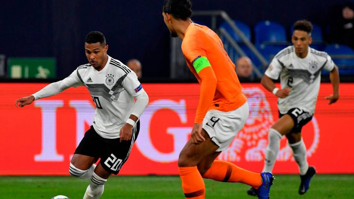 Germany's midfielder Serge Gnabry (L) runs with the ball during the UEFA Nations League football match Germany v the Netherlands in Gelsenkirchen, western Germany, on November 19, 2018. (Photo by John MACDOUGALL / AFP)        (Photo credit should read JOHN MACDOUGALL/AFP/Getty Images)