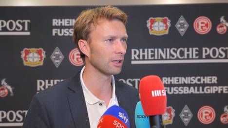 Droht Leverkusen ein weiterer Abgang in die Wüste? Bei Exequiel Palacios macht Bayer-Geschäftsführer Simon Rolfes auf dem Rheinischen Fußballgipfel seinen Standpunkt klar.