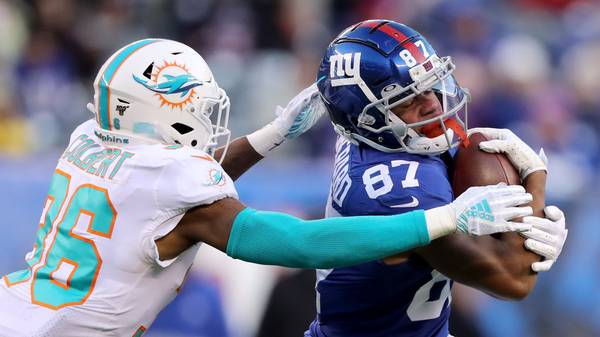 EAST RUTHERFORD, NEW JERSEY - DECEMBER 15:  Sterling Shepard #87 of the New York Giants carries the ball as Adrian Colbert #36 of the Miami Dolphins defends in the fourth quarter at MetLife Stadium on December 15, 2019 in East Rutherford, New Jersey. (Photo by Elsa/Getty Images)