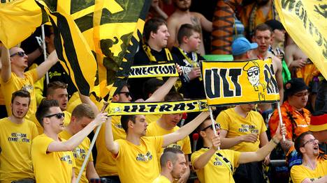 LOTTE, GERMANY - MAY 21:  Fans of Alemannia Aachen celebrate during the Regionalliga West match between SF Lotte and Alemannia Aachen at Sportpark am Lotterkreuz on May 21, 2016 in Lotte, Germany.  (Photo by Christof Koepsel/Bongarts/Getty Images)