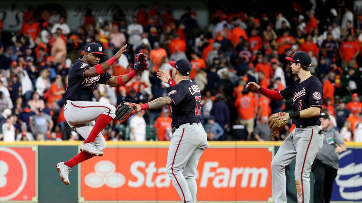 HOUSTON, TX - OCTOBER 29:  Victor Robles #16, Asdrubal Cabrera #13 and Trea Turner #7 of the Washington Nationals celebrates after the Nationals defeated the Houston Astros in Game 6 of the 2019 World Series at Minute Maid Park on Tuesday, October 29, 2019 in Houston, Texas. (Photo by Rob Tringali/MLB Photos via Getty Images)