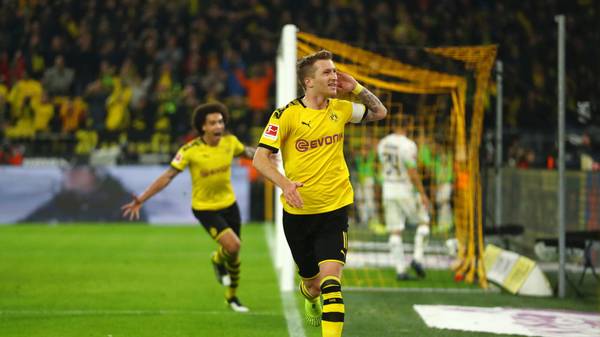 DORTMUND, GERMANY - OCTOBER 19: Marco Reus of Borussia Dortmund celebrates after scoring his team's first goal during the Bundesliga match between Borussia Dortmund and Borussia Moenchengladbach at Signal Iduna Park on October 19, 2019 in Dortmund, Germany. (Photo by Dean Mouhtaropoulos/Bongarts/Getty Images)