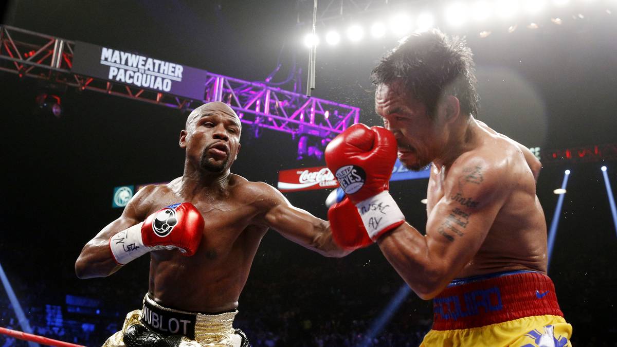 ... und besiegt Pacquiao - der sich durch eine Verletzung gehandicapt sieht - souverän nach Punkten