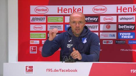 Beim Remis zwischen der TSG Hoffenheim und Fortuna Düsseldorf fliegt TSG-Profi Benjamin Hübner wegen Tätlichkeit früh vom Platz. Für seinen Coach Alfred Schröder eine zu harte Entscheidung.