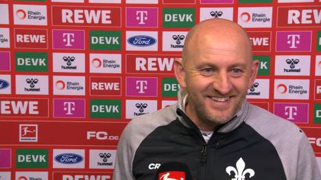 Darmstadt-Trainer Torsten Lieberknecht freut sich über den 2:0-Erfolg seiner Lilien in Köln, aber auch mit dem BAP-Sänger Wolfgang Niedecken.