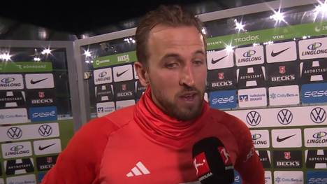 Bayerns Top-Stürmer Harry Kane freut sich über den Arbeitssieg gegen den VfL Wolfsburg und erklärt sein Traumtor zum zwischenzeitlichen 0:2.